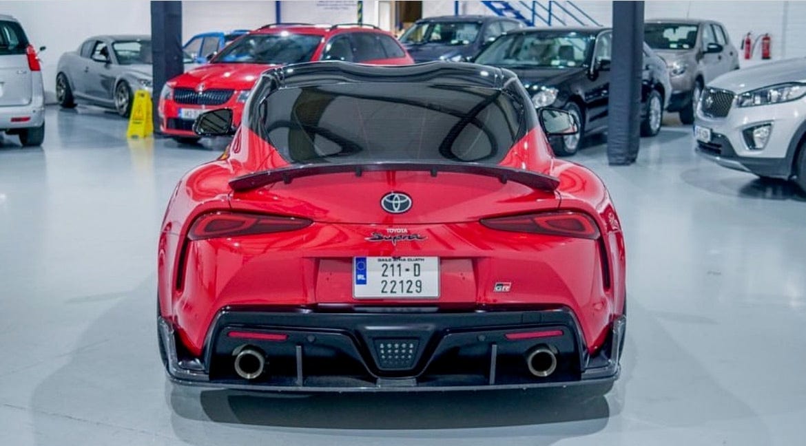 Carbon fibre spoiler for Toyota Supra 2019+ A90 by CT Carbon, showcased on the car's rear with a sleek aerodynamic design.