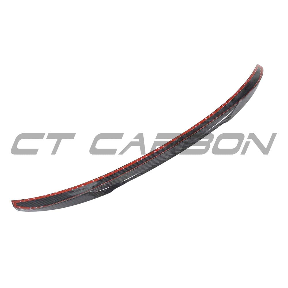 BMW G30 5 Series 2016-2023 CT Carbon fiber kit featuring M4-style spoiler and carbon fiber accents on vehicle parts.