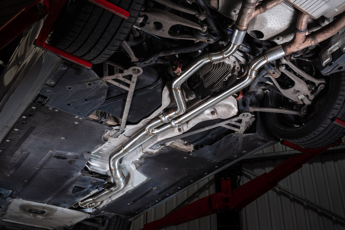 Scorpion BMW M3 F80 and M4 F82 F83 exhaust mid pipe, single mid pipe design, metal construction with Scorpion branding visible.