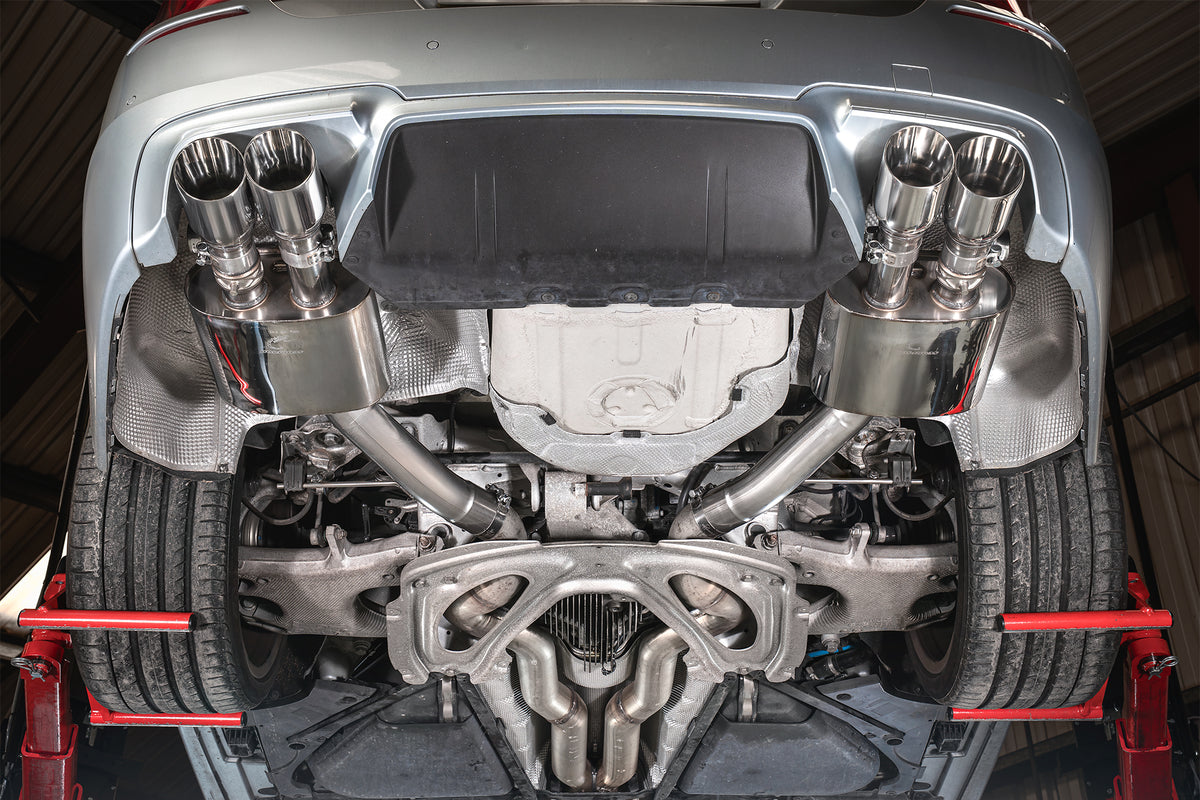 Scorpion BMW M5 F10 rear silencer showing polished metal finish and dual exhaust tips on the vehicle.
