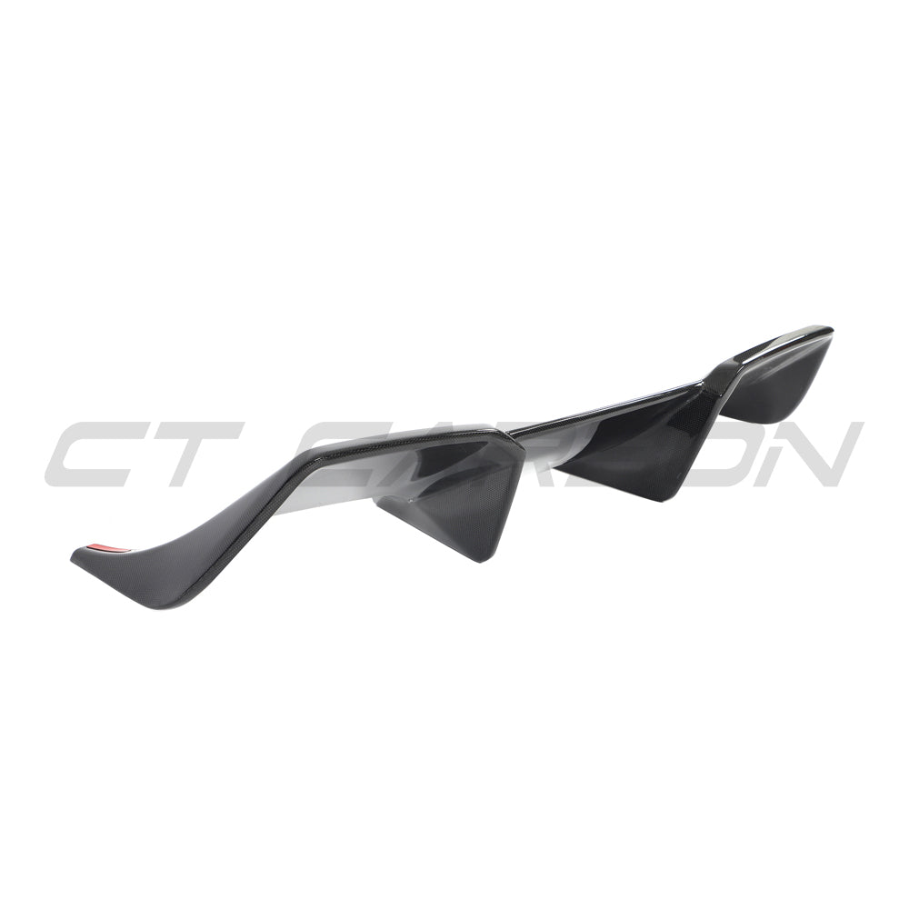 Ferrari 812 Superfast carbon fibre diffuser by CT Carbon, showcasing sleek black aerodynamic design and detailed construction.