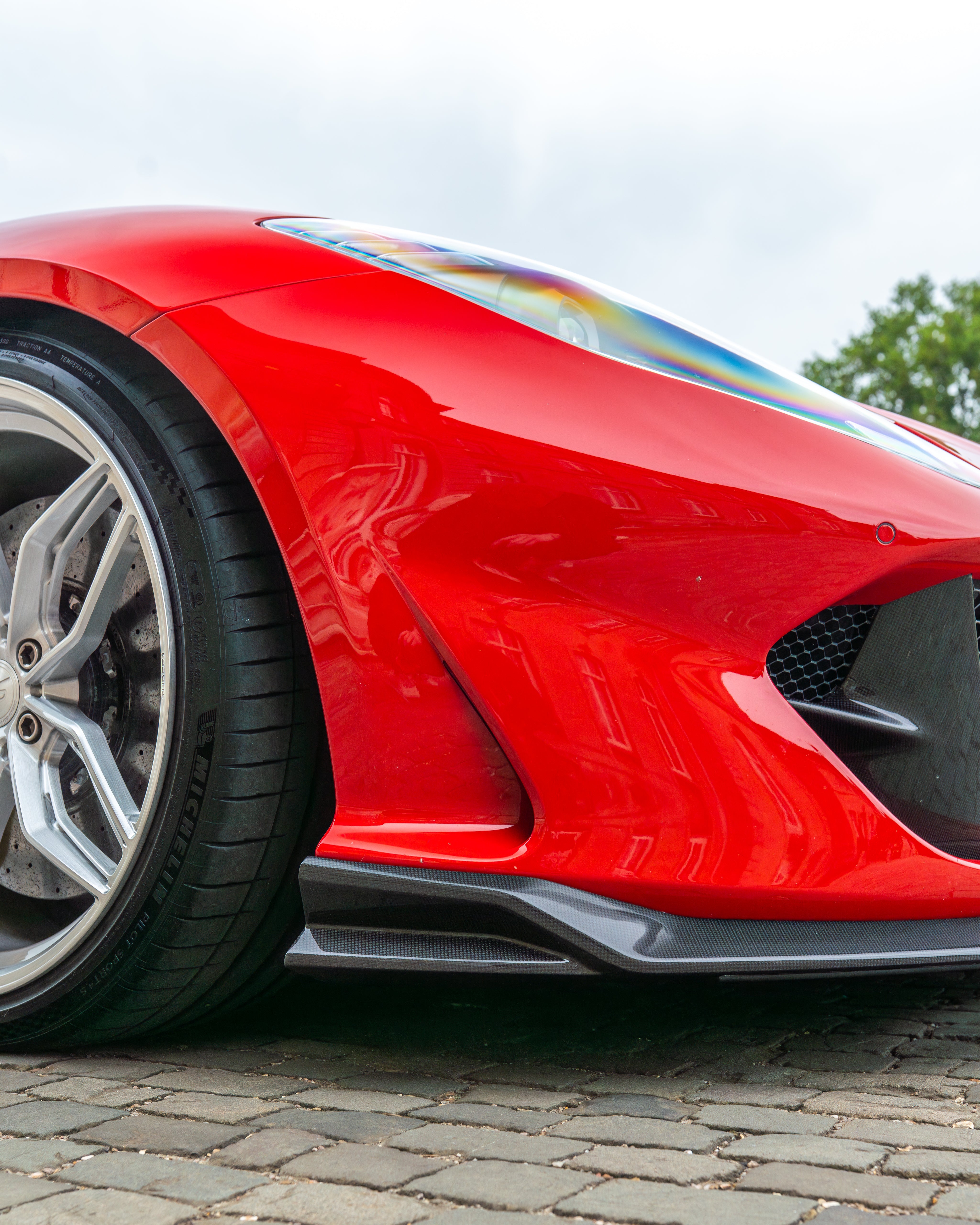 Ferrari 812 Superfast carbon fibre splitter kit by CT Design, showcasing sleek, lightweight carbon fibre components for the supercar.