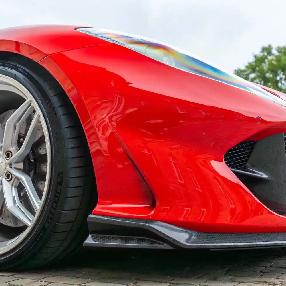 Ferrari 812 Superfast & GTS carbon fibre splitter by CT Carbon, showcasing sleek aerodynamic design and lightweight construction.