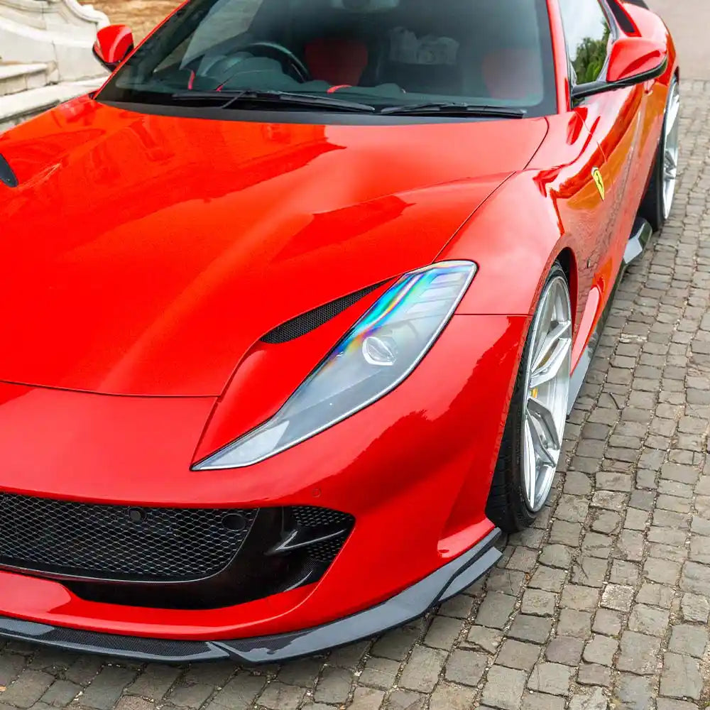 Carbon fiber splitter for Ferrari 812 Superfast and GTS by CT Carbon, shown installed on the car's front bumper.