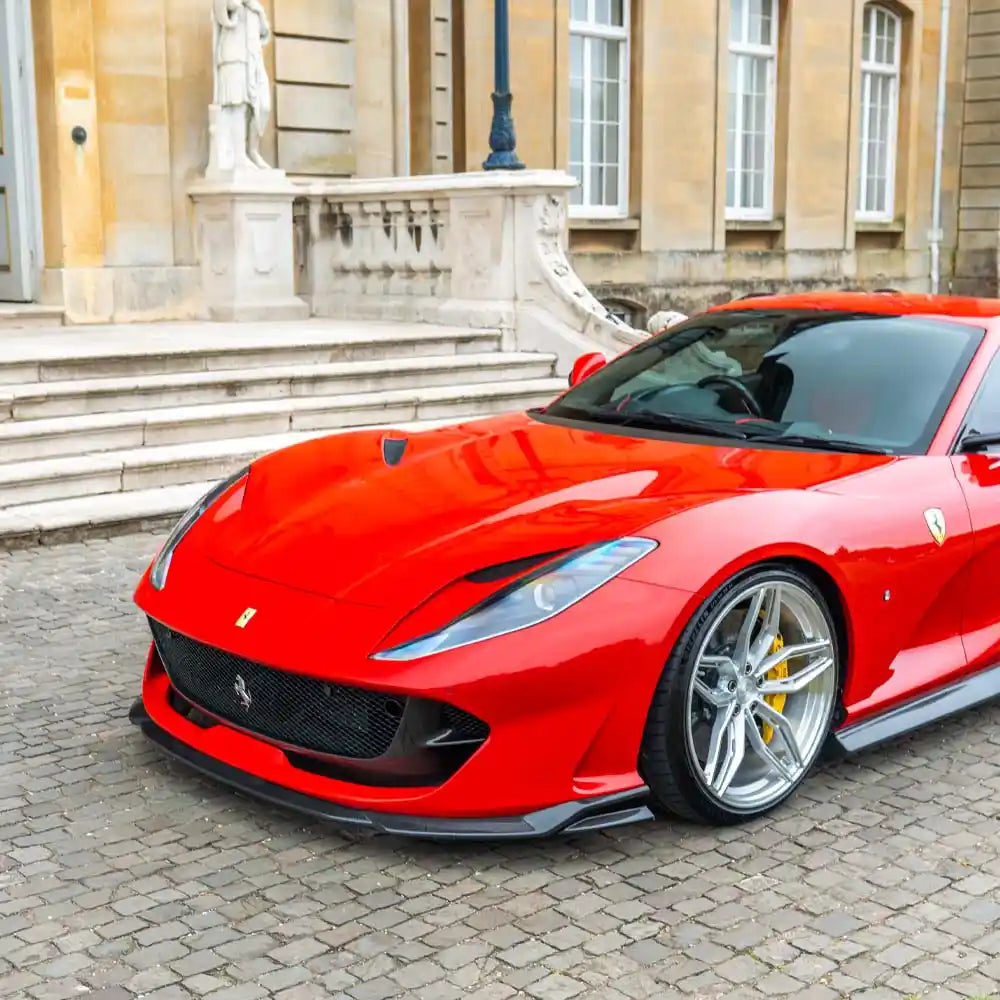 Ferrari 812 Superfast & GTS carbon fibre splitter by CT Design, showing sleek aerodynamic enhancement on the car's front.