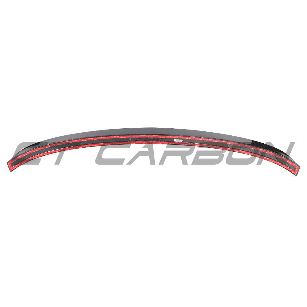 Audi RS6 C8 Avant CT Design carbon fiber middle spoiler mounted on the car's rear, showcasing its sleek, aerodynamic style.