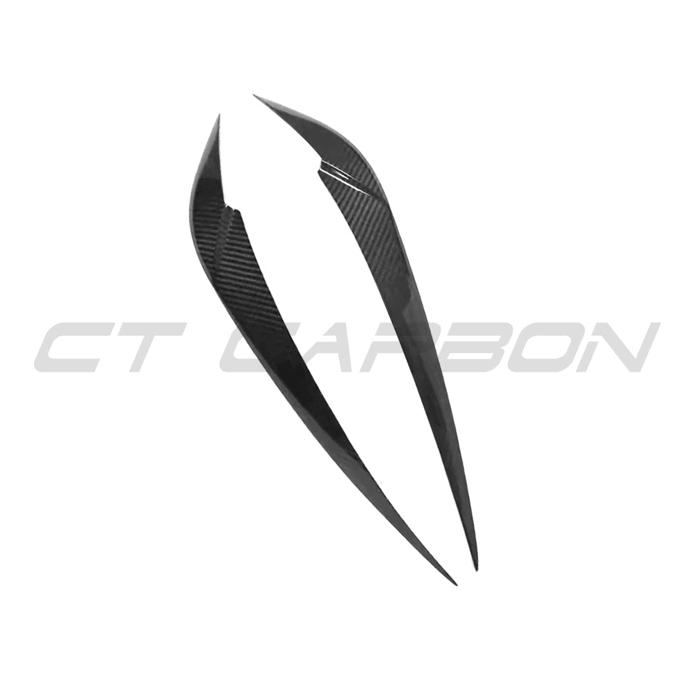 BMW M3 and M4 G8X carbon fibre headlight eyebrow accessory by CT Carbon, showcasing sleek, lightweight headlight accents.