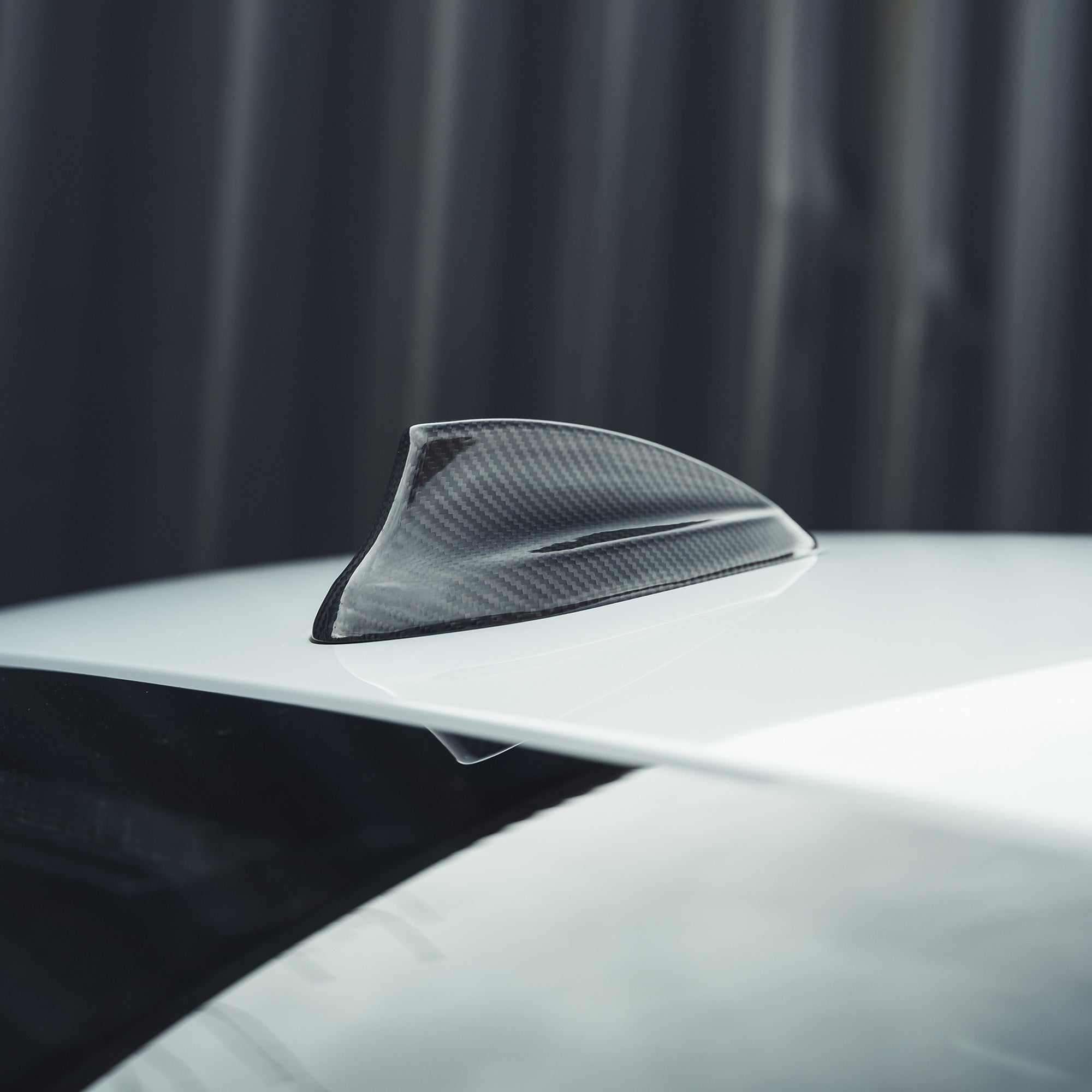 BMW Fxx carbon fibre antenna cover accessory by CT Carbon, close-up view showing sleek black textured finish