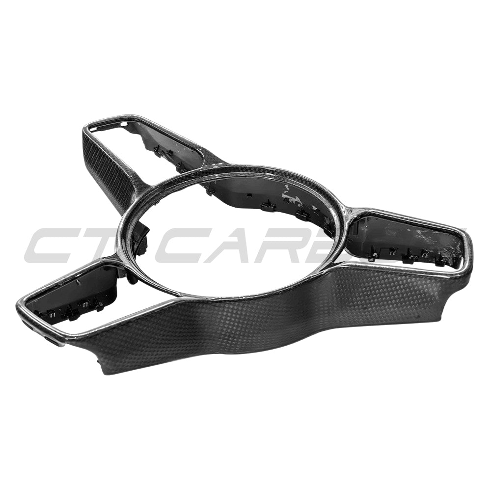 CT Carbon Porsche 911, Cayman, Boxster, Cayenne, Macan steering wheel trim accessory showing close-up of black carbon fiber finish