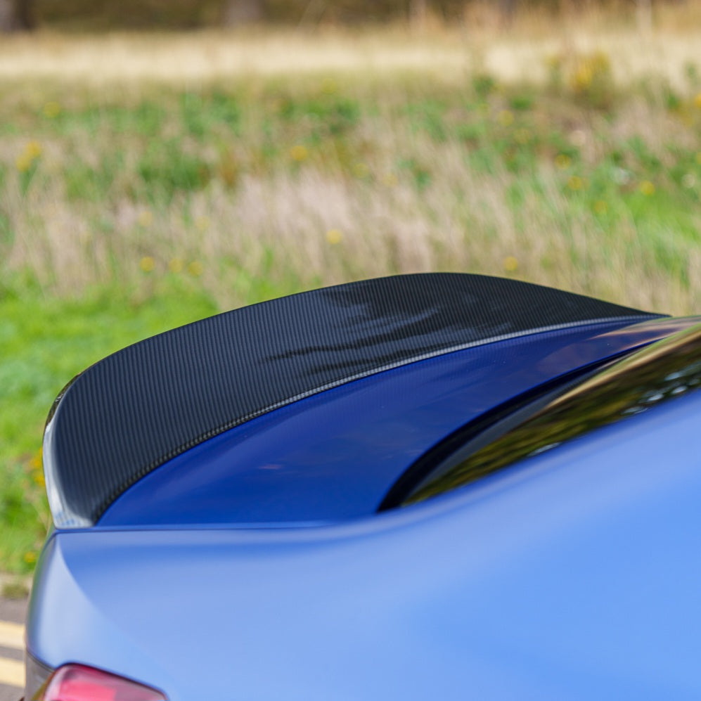 BMW G80 M3 and G20 3 Series carbon fibre spoiler by CT Carbon, showcasing the sleek aerodynamic design and glossy finish.