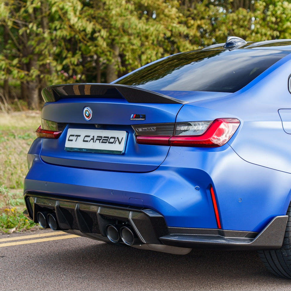 BMW G80 M3 and G20 3 Series carbon fiber spoiler by CT Carbon, showing the sleek, aerodynamic design on the car's rear.