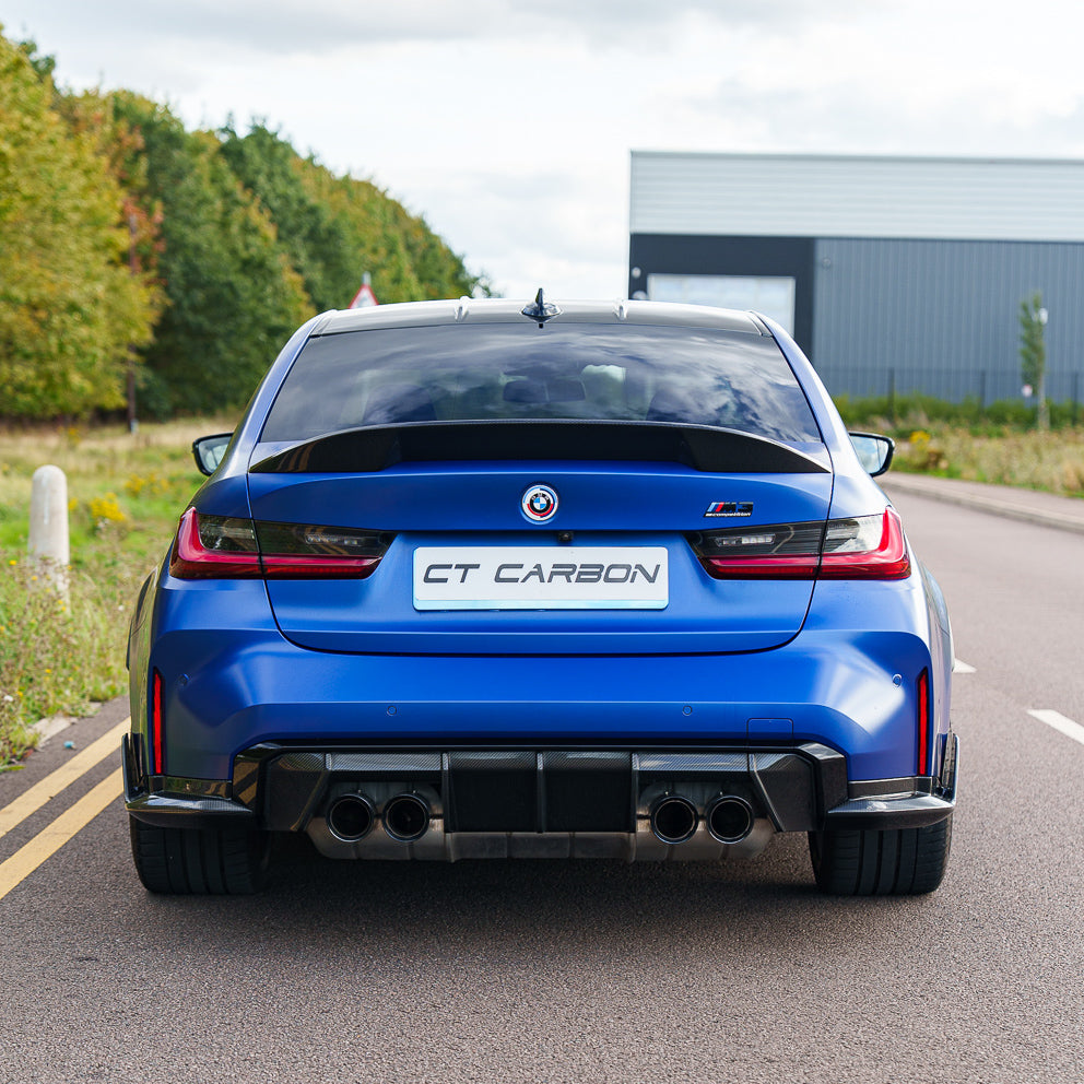 BMW G80 M3 and G20 3 Series carbon fibre spoiler by CT Carbon, showing sleek, aerodynamic design on a sporty car.