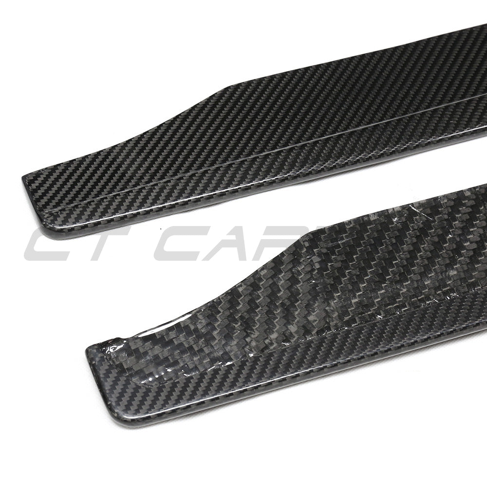 BMW G87 M2 carbon fibre side skirts by CT Carbon, showing sleek, aerodynamic design and textured finish on the car side.