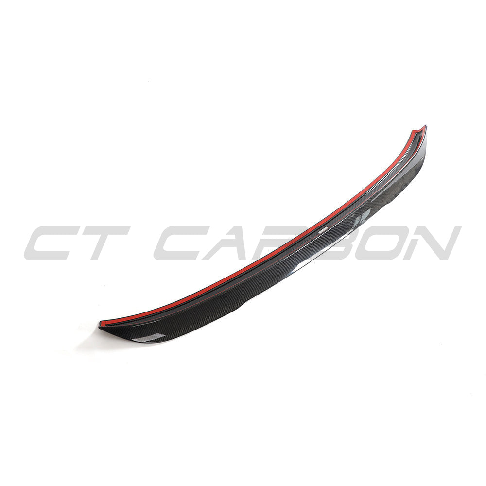 BMW G02 X4 and F98 X4M carbon fiber spoiler from CT Carbon, showing the sleek, aerodynamic design on the vehicle's rear.