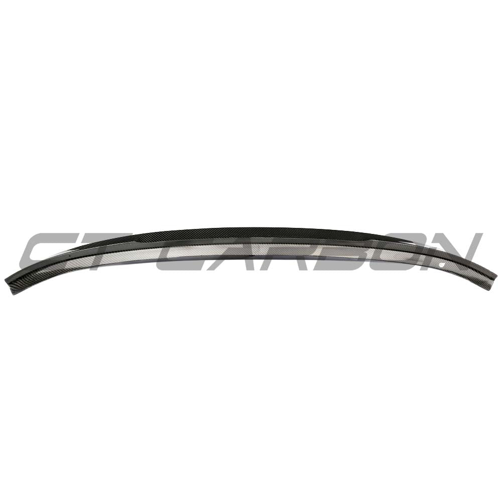 BMW F98 X4M carbon fibre spoiler by CT Carbon, V3 version, showing sleek aerodynamic design on the vehicle's rear.