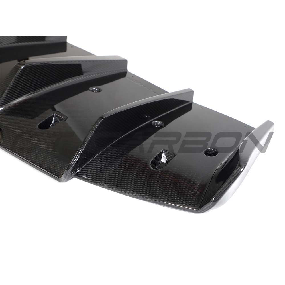 CT Carbon Lotus Emira full carbon fibre kit V2, including front splitter, side skirts, and rear diffuser on a sports car.