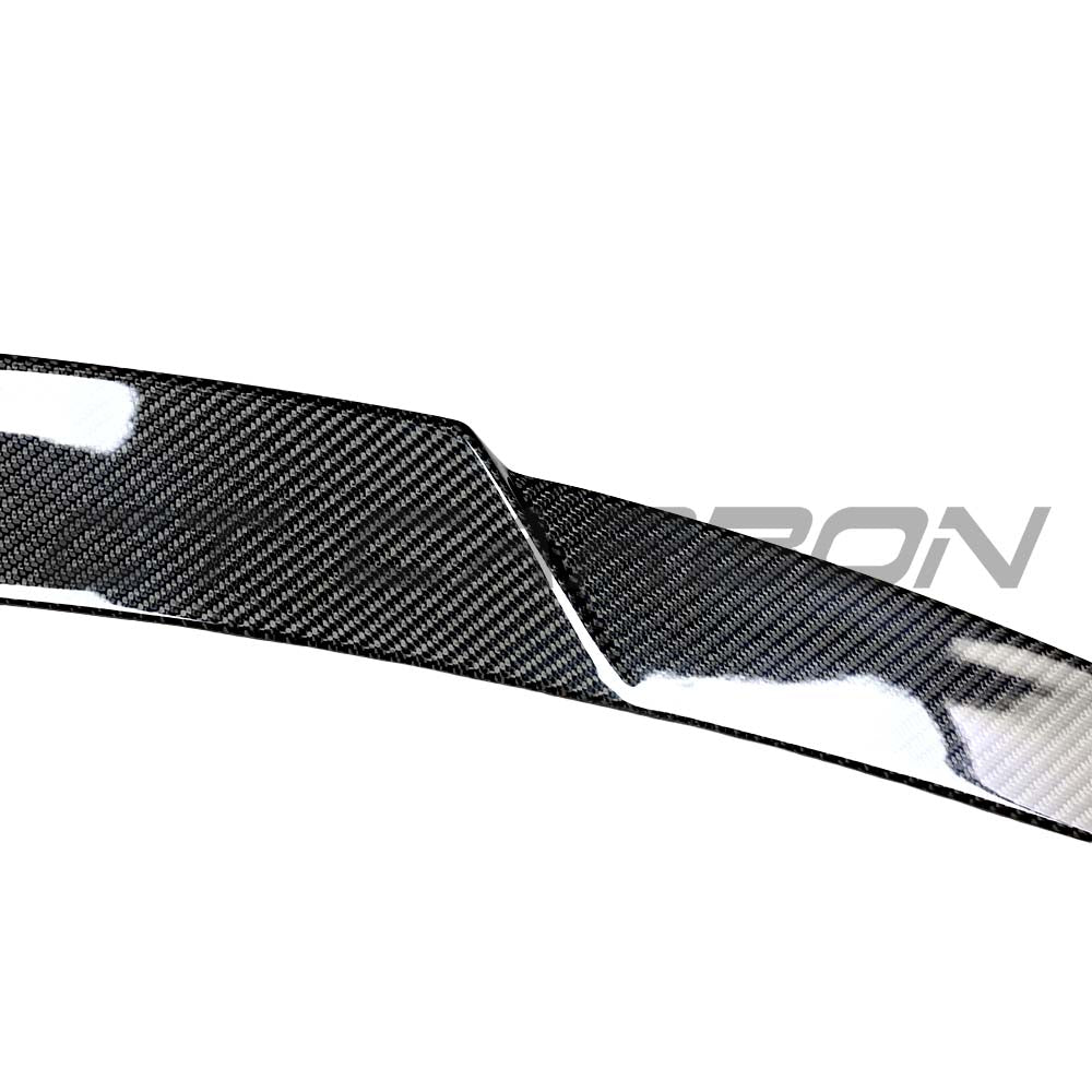 Mercedes C-Class W206 sedan carbon fiber spoiler by CT Carbon, sporty and aerodynamic design, shown on the car's rear.