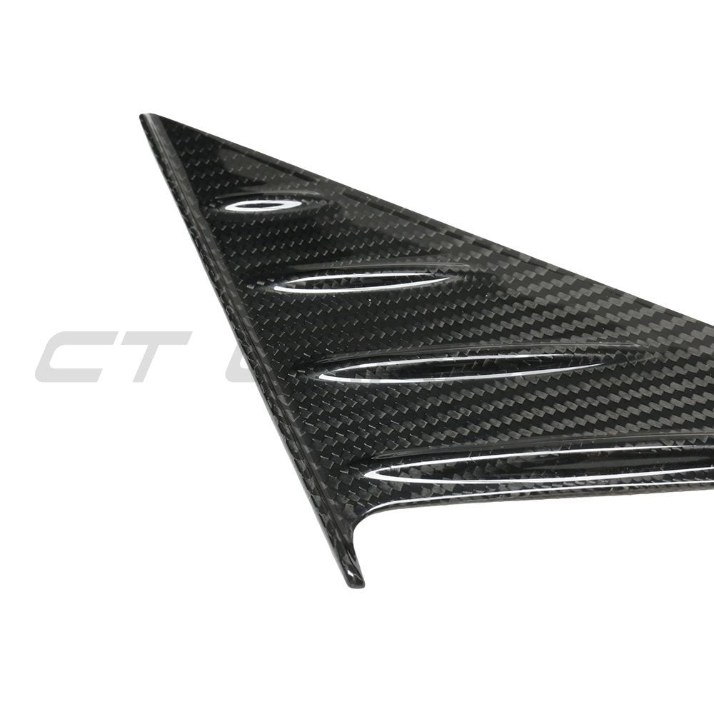 BMW G22 G23 G26 4 Series 2021+ dry carbon fibre mirror pillar trim by CT Carbon, showing sleek, textured carbon fiber finish.