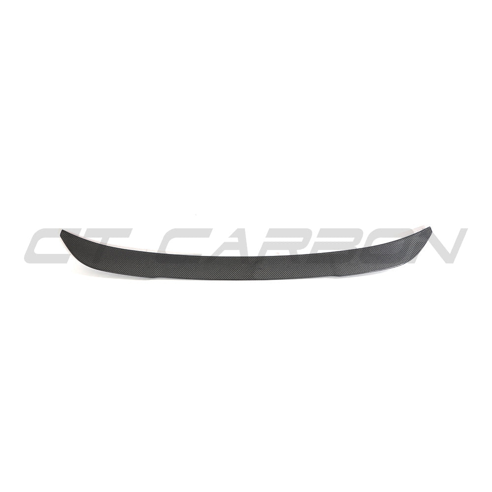 BMW G02 X4 and F98 X4M carbon fiber spoiler by CT Carbon, showcasing the sleek, aerodynamic design on a black vehicle.