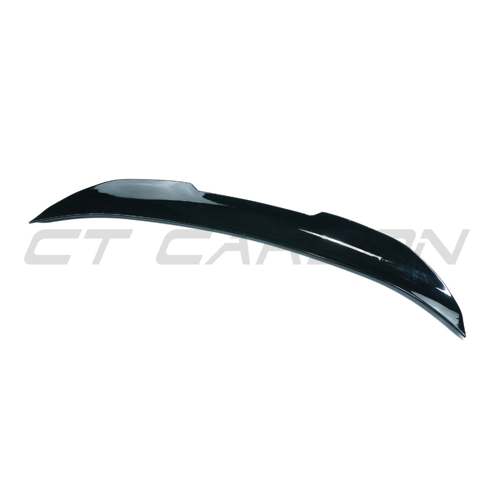 BMW 5 Series F10 2011-2017 CT Carbon gloss black spoiler, V2, mounted on the rear of the vehicle, showcasing sleek aerodynamic design.