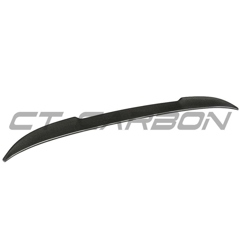 BMW F98 X4M carbon fibre spoiler by CT Carbon, showcasing the sleek, aerodynamic V2 design on the vehicle's rear.