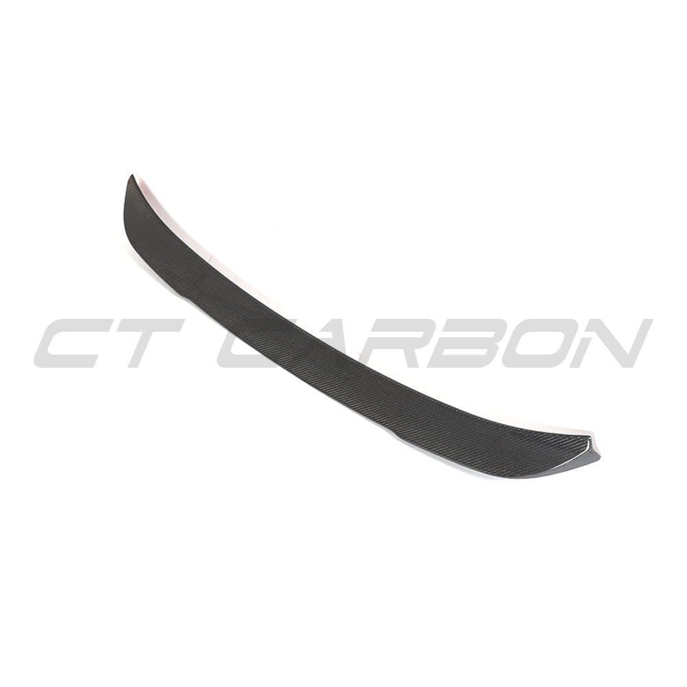 BMW G02 X4 and F98 X4M carbon fibre spoiler by CT Carbon, showcasing sleek, aerodynamic design for sporty appearance.