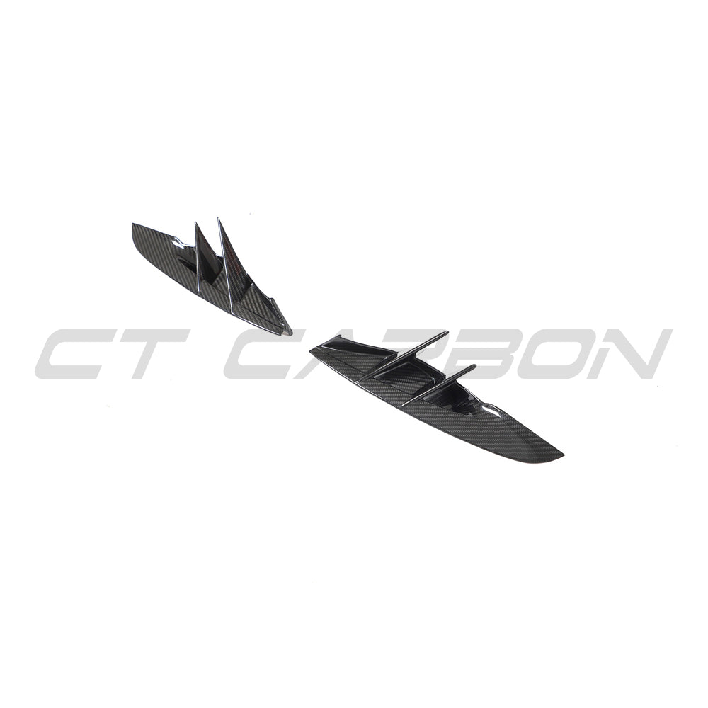 Toyota Supra 2019+ A90 carbon fiber front bumper vent trim accessory by CT Carbon, showing close-up of textured black carbon fiber detail.