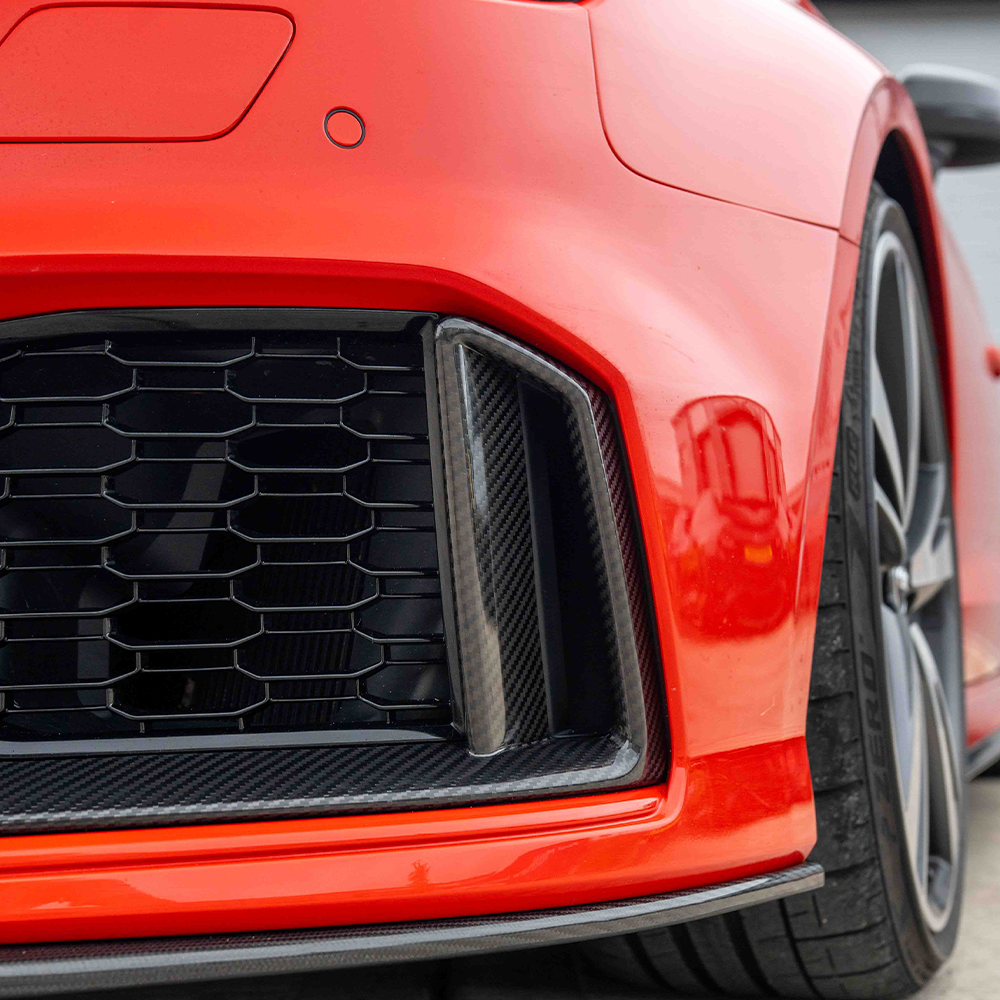 CT Carbon Audi RS3 8V facelift carbon fiber bumper trim accessory, showing close-up of sleek, textured carbon fiber detail.