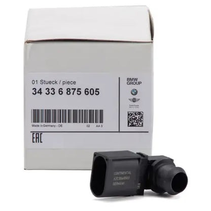 Genuine BMW brake vacuum sensor 34336875605, showing the small automotive sensor part on a neutral background.