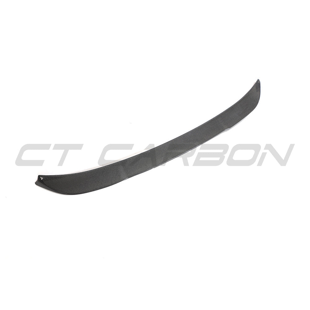 BMW G02 X4 and F98 X4M carbon fibre spoiler by CT Carbon, shown mounted on the vehicle's rear for aerodynamic enhancement.