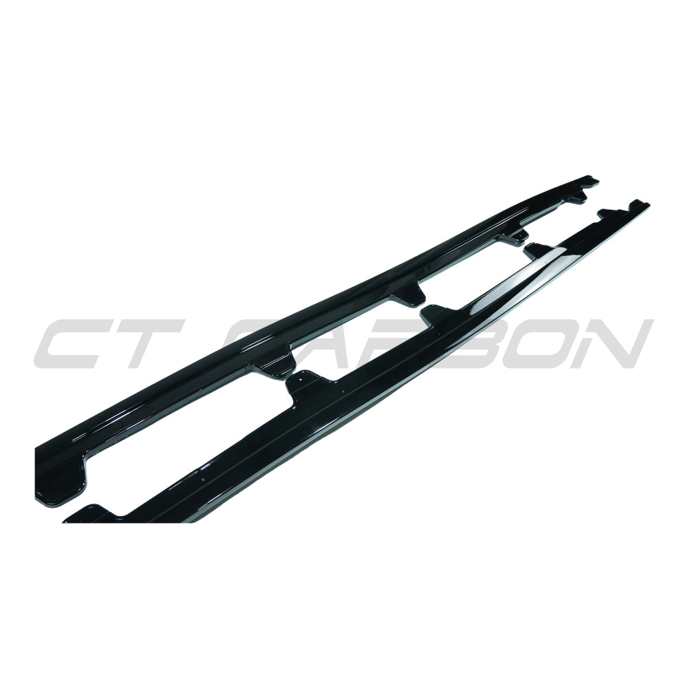 BMW E90/E91 3 Series 2005-2013 gloss black side skirts by CT Carbon, showing sleek aerodynamic design for a sporty look.