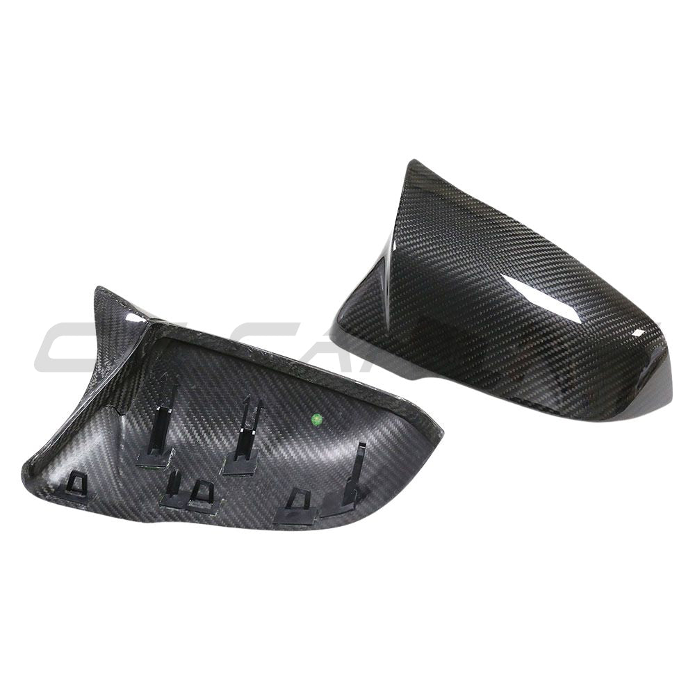 Toyota Supra A90 carbon fiber mirrors by CT Carbon, close-up of sleek, lightweight car accessories with a glossy finish.