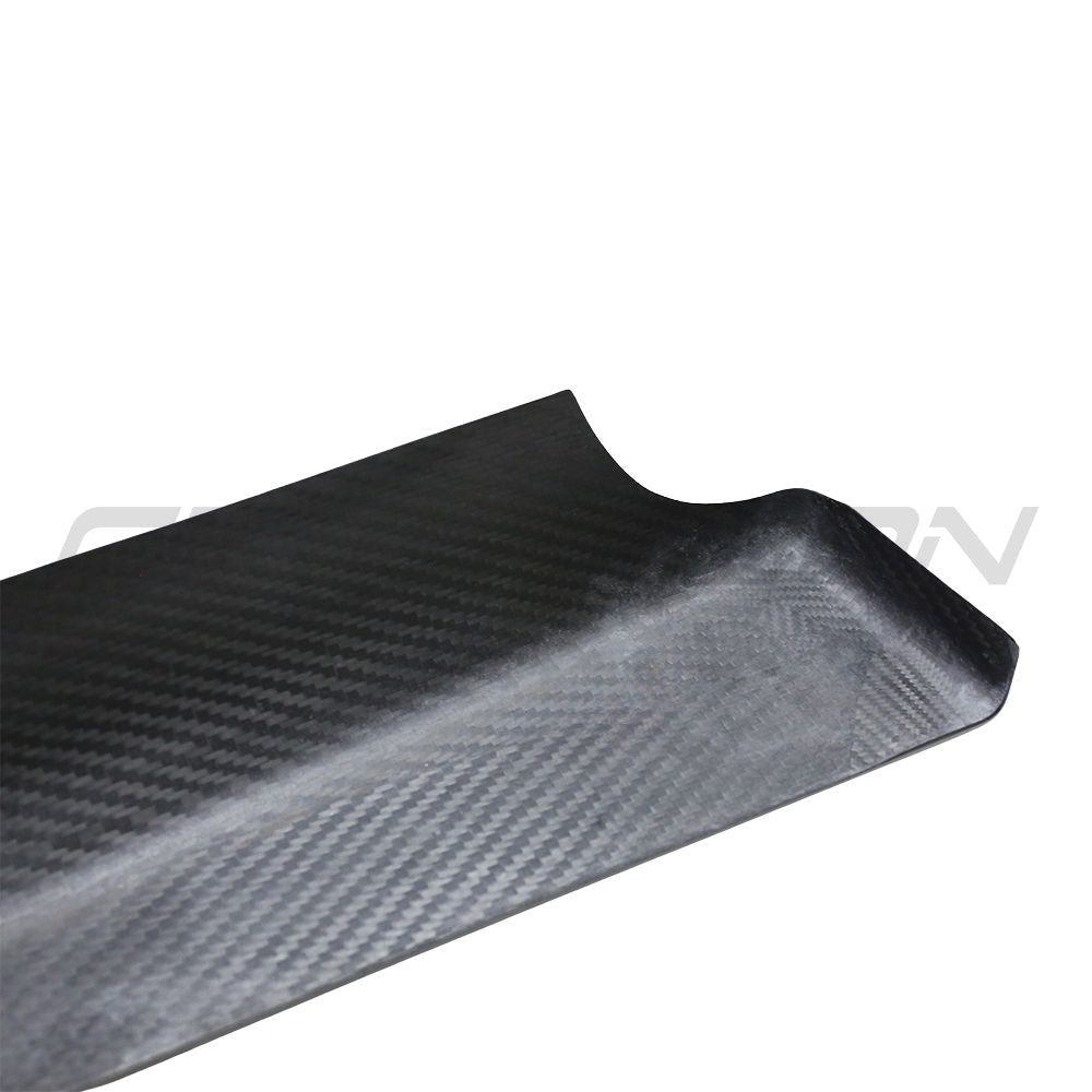 Tesla Model 3 2017-2023 carbon fiber interior door panel trim accessory by CT Carbon, shown installed inside the vehicle.