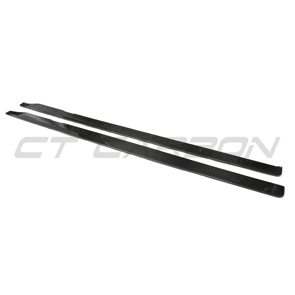BMW G87 M2 carbon fibre side skirts by CT Carbon, lightweight and aerodynamic, shown on a sleek sports car.
