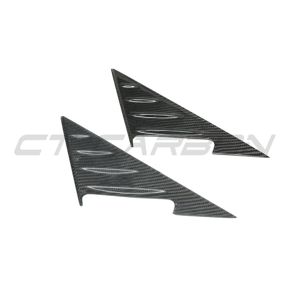 BMW G87 M2 2023 dry carbon fibre mirror pillar trim accessory by CT Carbon, showing close-up of sleek black carbon finish.