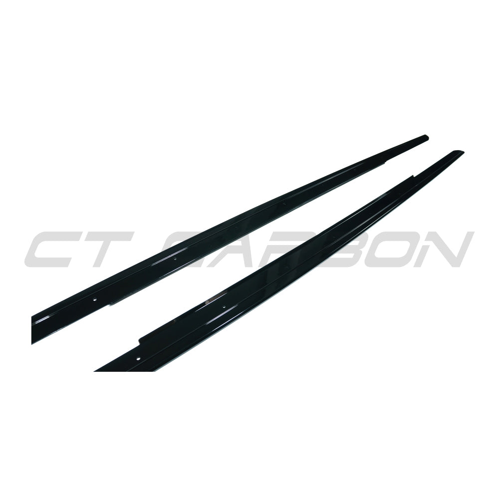 BMW 5 Series F10/F11 2011-2017 CT Carbon gloss black side skirts installed on vehicle.