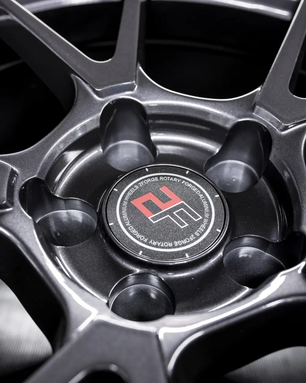 Close-up of 2Forge ZF6 semi-forged wheels showing detailed metallic finish and multi-spoke design for enhanced vehicle style.