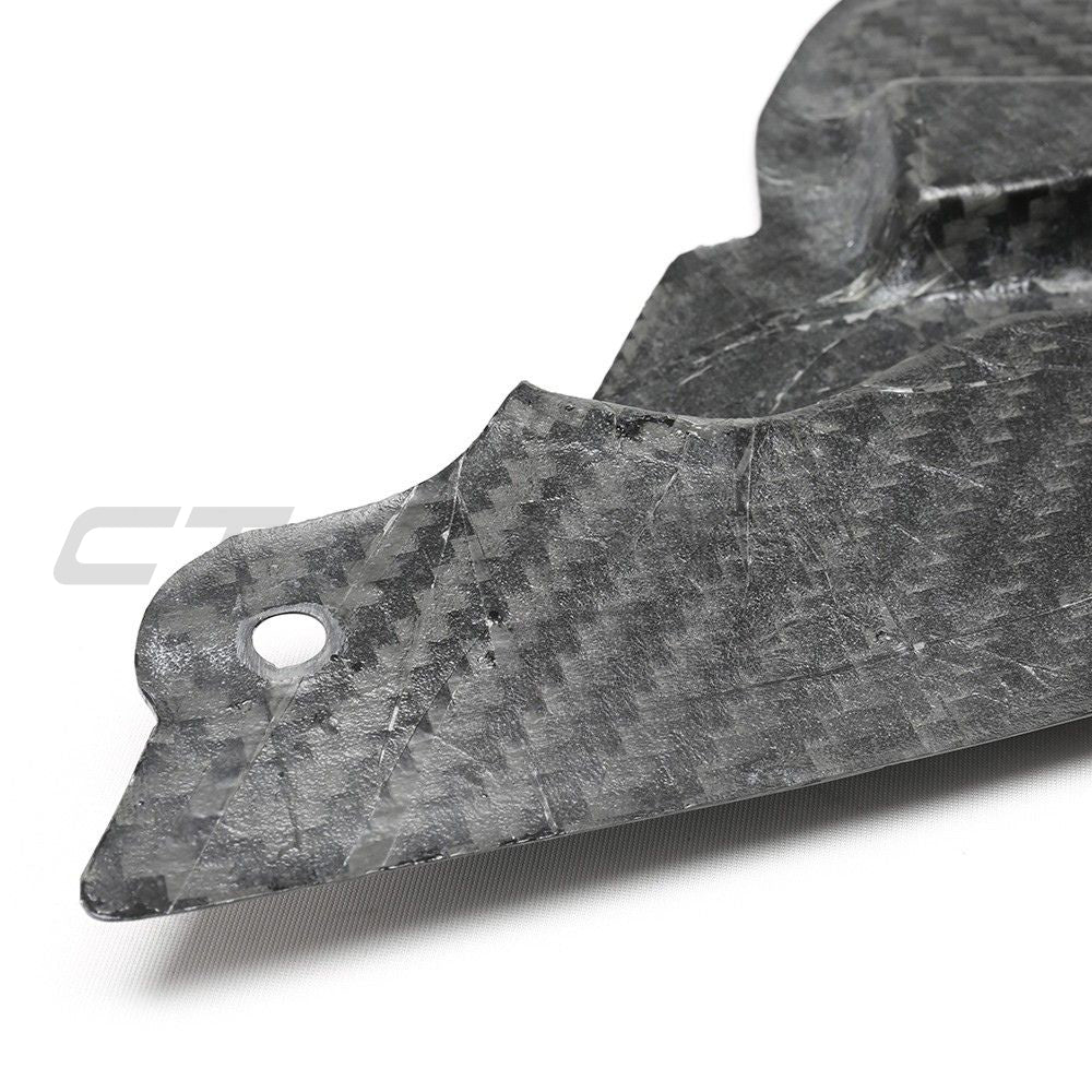 BMW M3 and M4 G80/G81/G82/G83 carbon fibre headlight cover by CT Carbon, showcasing sleek, lightweight automotive accessories.