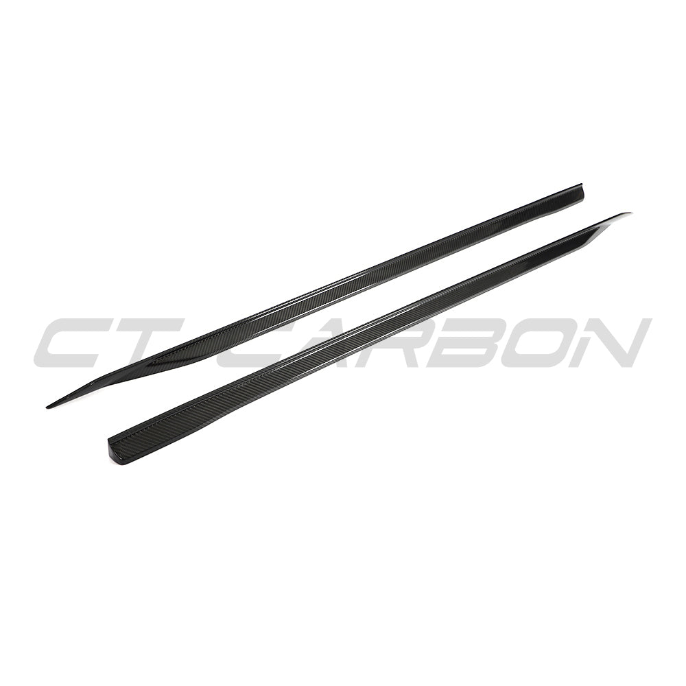 BMW 5 Series G60/G61 2024+ CT Carbon carbon fiber side skirts installed on the vehicle, showcasing sleek aerodynamic design.