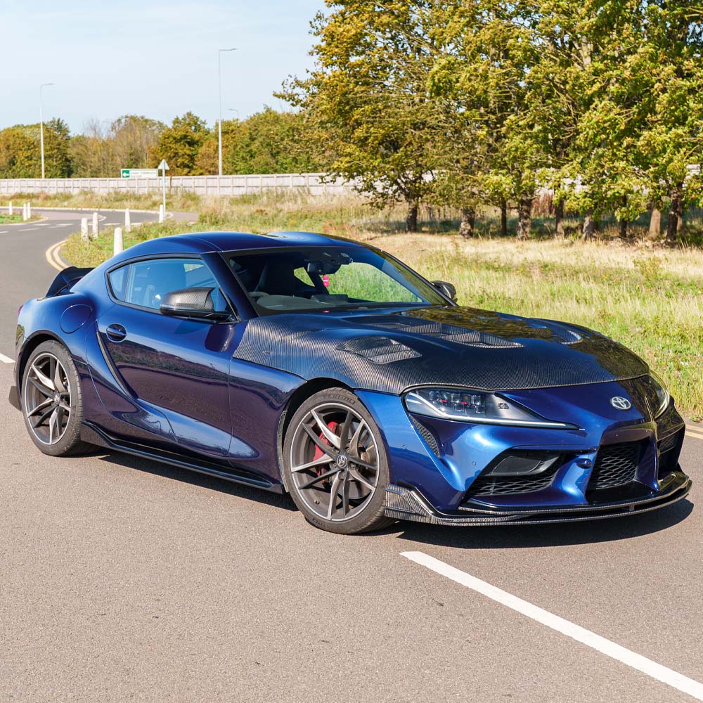 Toyota Supra 2019+ A90 CT Carbon ultimate carbon fiber kit installed on the sporty coupe, showcasing sleek, high-performance design.