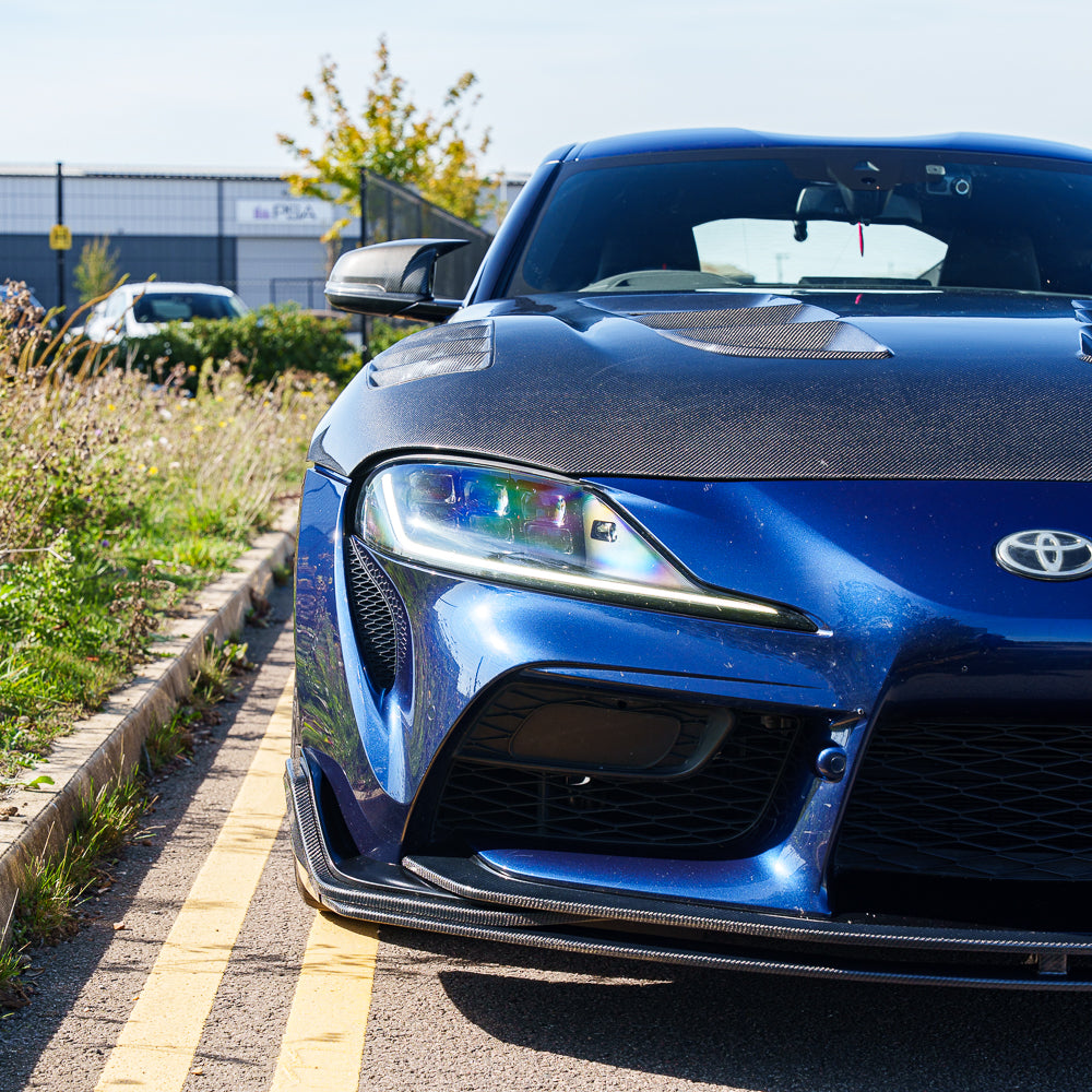 Carbon fiber splitter for Toyota Supra 2019+ A90 model by CT Carbon, showing the sleek, aerodynamic front splitter design.