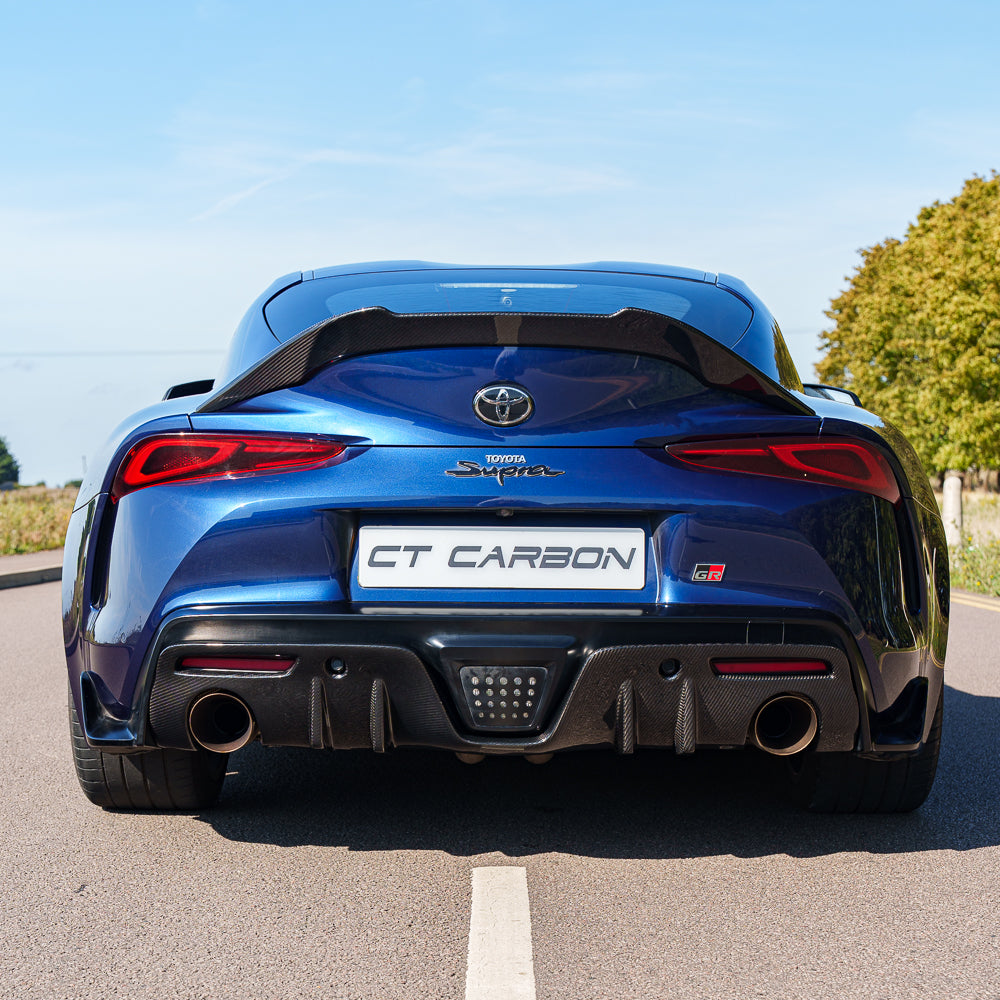 Toyota Supra 2019+ A90 Carbon Fibre Spoiler by CT Carbon, showcasing the sleek, aerodynamic design of the V2 spoiler on the car.