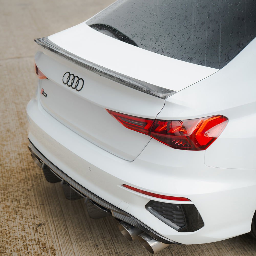 Full Audi A3/S3 8Y saloon carbon fiber kit by CT Design, featuring sleek carbon fiber panels and accents on the car body.