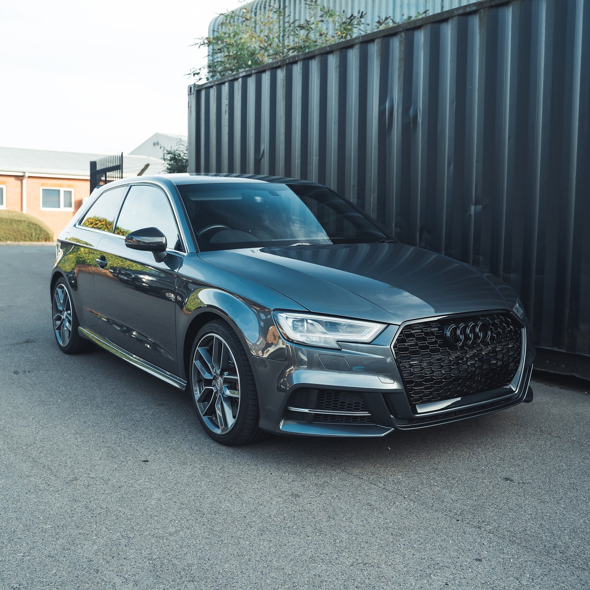 Audi A3/S3/RS3 8V pre-preg carbon fiber door mirror covers by CT Carbon, without lane assist, showing sleek black finish.