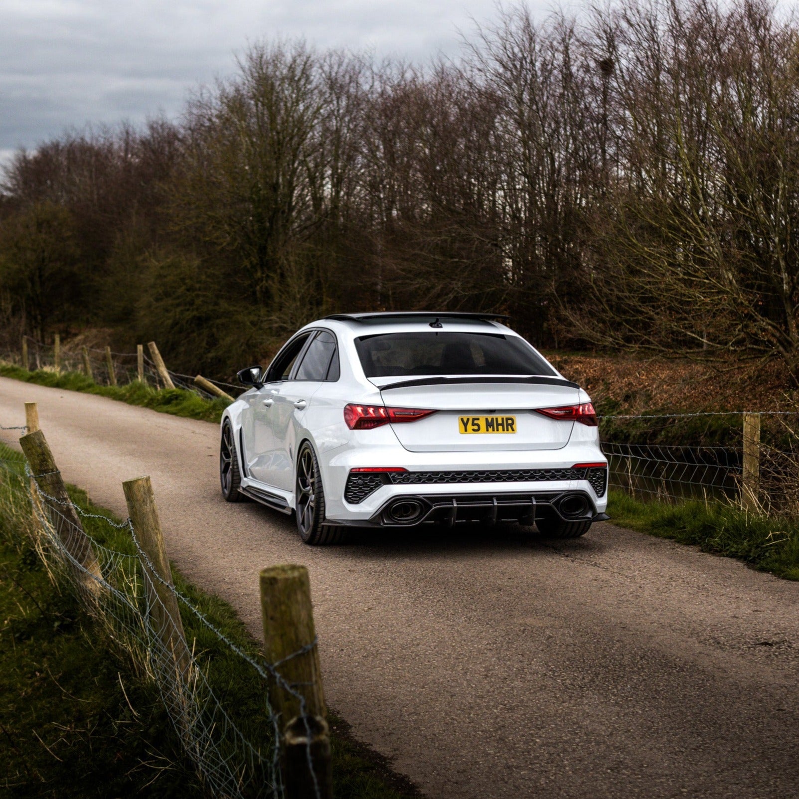 Carbon fiber spoiler for Audi A3/S3/RS3 8Y saloon by CT Design, shown installed on the car's rear edge.