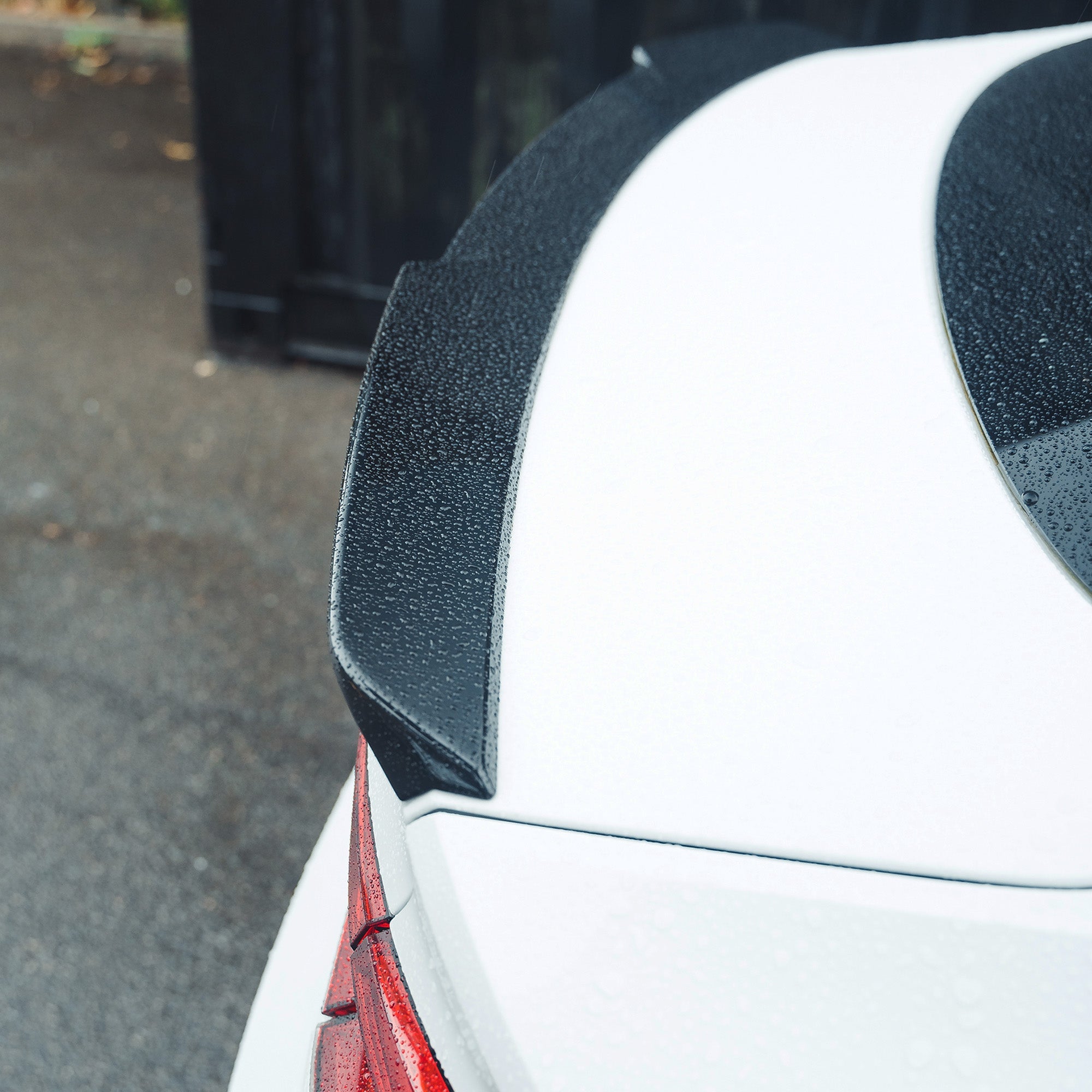 Gloss black spoiler for Audi A5/S5 B9 Sportback by CT Carbon, shown on the vehicle’s rear with a sleek, aerodynamic design.