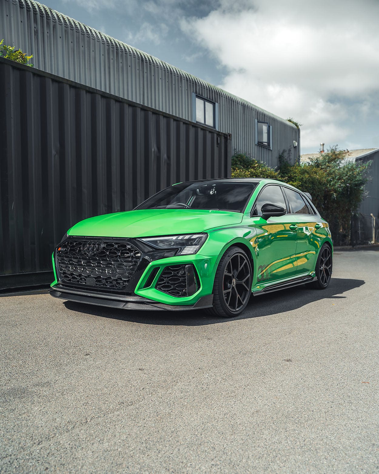 CT Carbon Audi RS3 8Y 2022-2024 Sportback carbon fibre kit without spoiler, showing sleek, textured carbon fibre panels on the car.