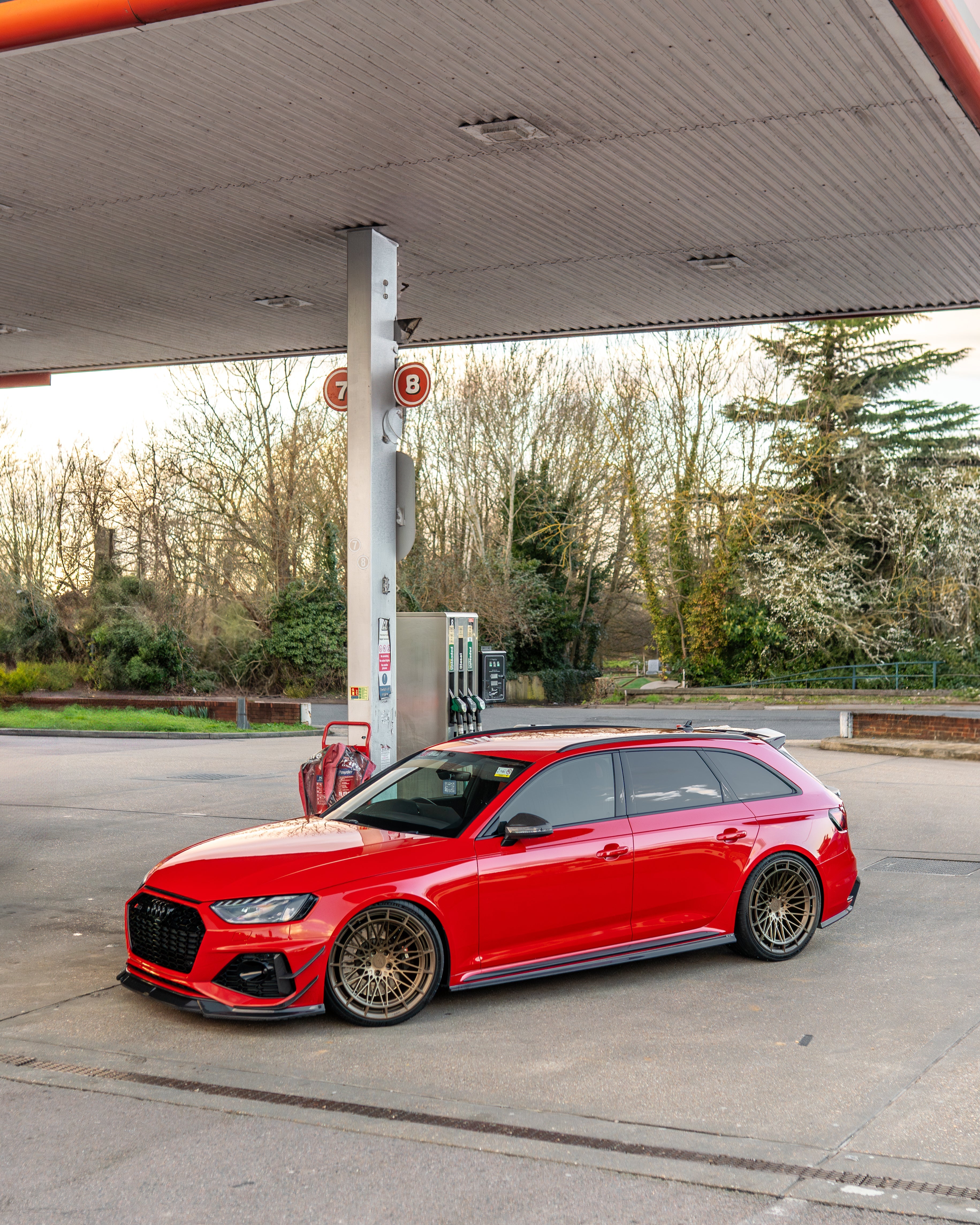Audi RS4 B9.5 carbon fibre splitter by CT Carbon, front view showing sleek aerodynamic design and textured carbon fibre surface.