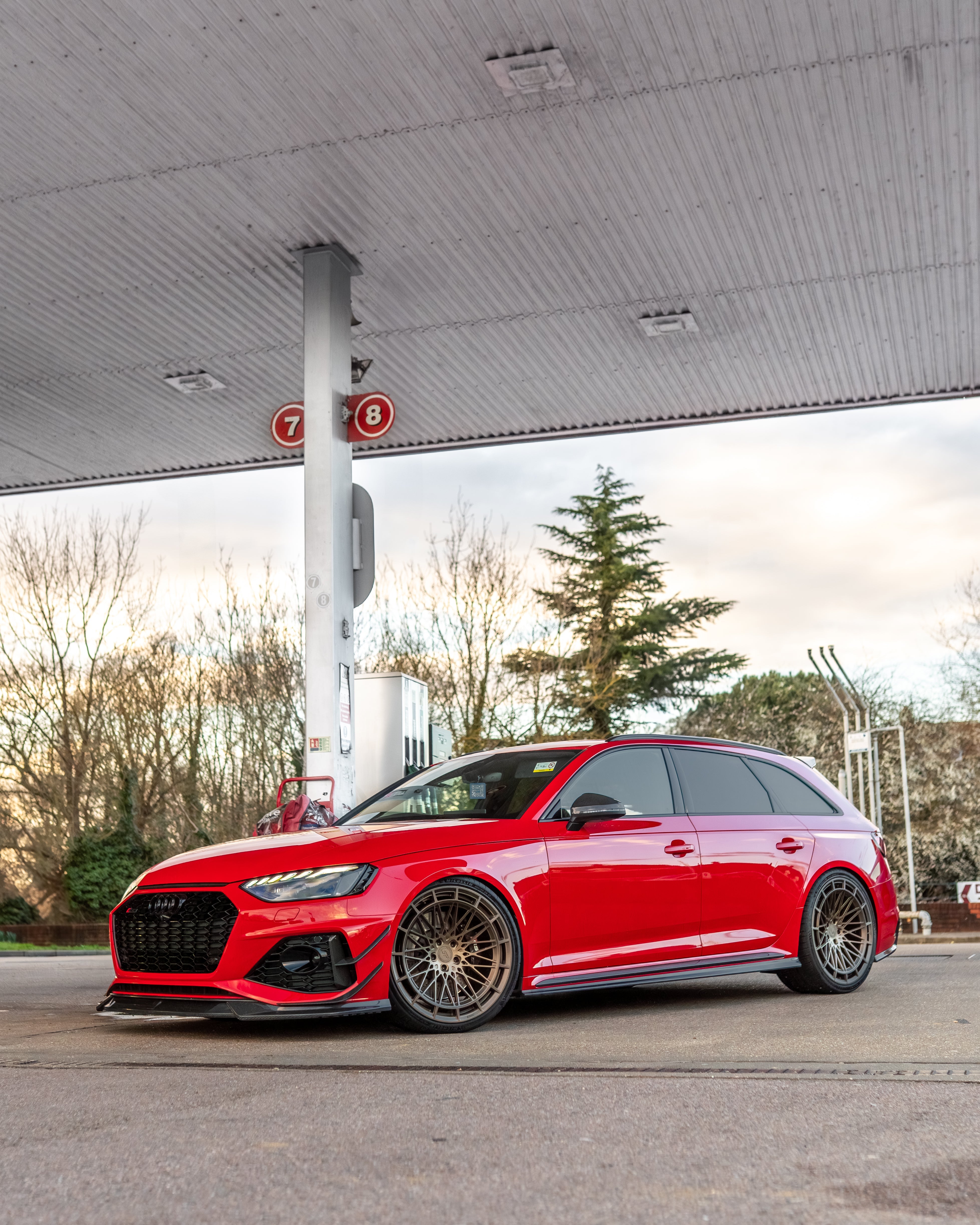 Audi RS4 B9.5 carbon fiber side skirts by CT Carbon, designed for sporty enhancement, mounted on the vehicle's sides.