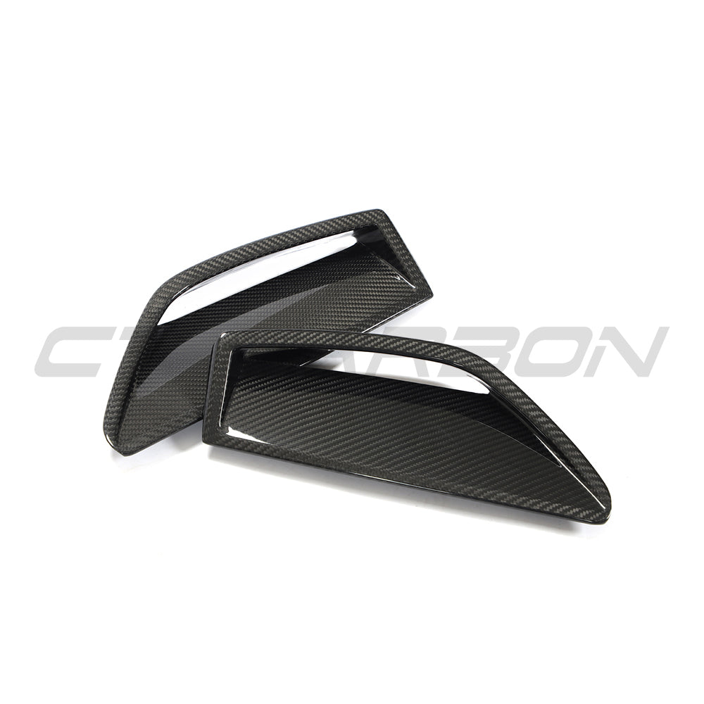 Carbon fiber front bumper vent trim for Audi RS6/RS7 C8 Avant 2019+ by CT Carbon, showcasing sleek, textured carbon fiber surface.